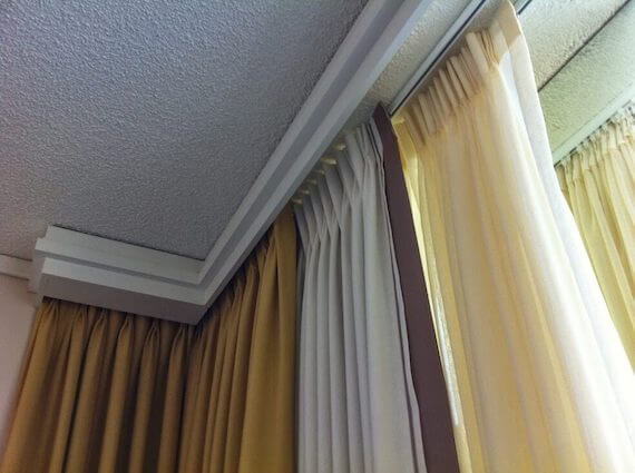 Hotel drapery installed on corner window